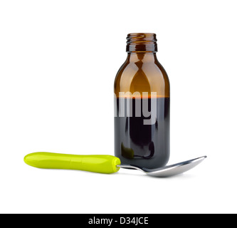 Nahaufnahme eines Medizin-Flasche mit Sirup und Löffel isoliert Stockfoto