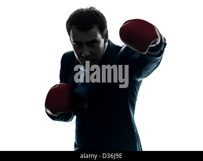 ein Geschäftsmann mit Boxhandschuhen Silhouette Studio isoliert auf weißem Hintergrund Stockfoto