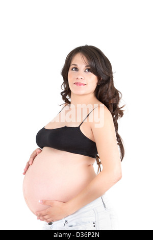 Junge schöne schwangere Frau mit langen dunklen Haaren. Stockfoto