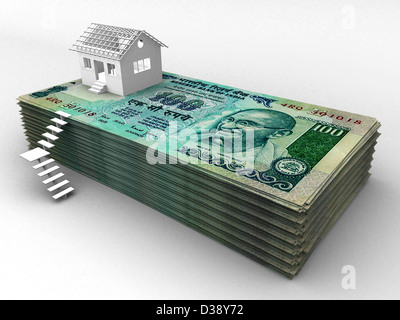 Haus auf Stapel von hundert Rupien Banknoten Stockfoto