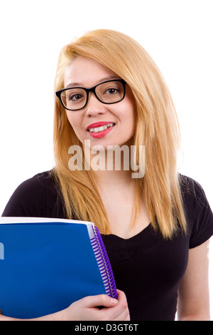 Stilvolle junge Studentin hält den Lehrbüchern und lächelt mit Brille. Stockfoto