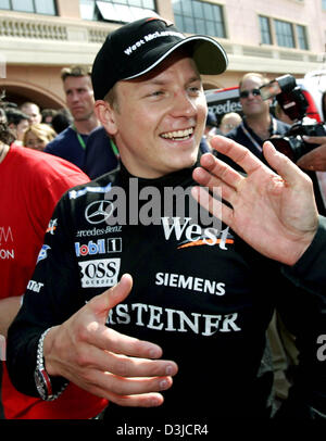 (Dpa) - lächelt finnischen Formel-1-Rennfahrer Kimi Räikkönen von McLaren Mercedes nach dem Gewinn des Grand Prix von Monaco in Monte Carlo, Monaco, Sonntag, 22. Mai 2005. Stockfoto