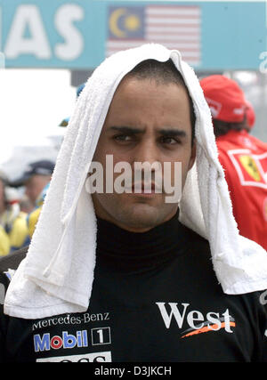 (Dpa) - kolumbianische Formel Eins Fahrer Montoya (McLaren-Mercedes) vor dem Grand Prix von Malaysia in Sepang, in der Nähe von Kuala Lumpur, Malaysia, 20. März 2005. Montoya beendete 4.. Stockfoto