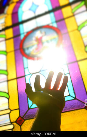 Bitte an Gott: Hand hob Jesus Stockfoto