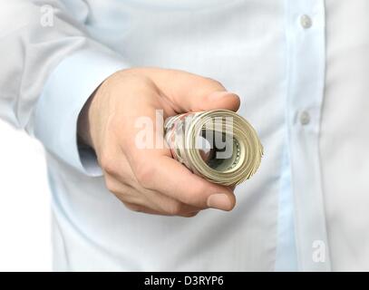 Eine Rolle von Dollar in einer hand Stockfoto