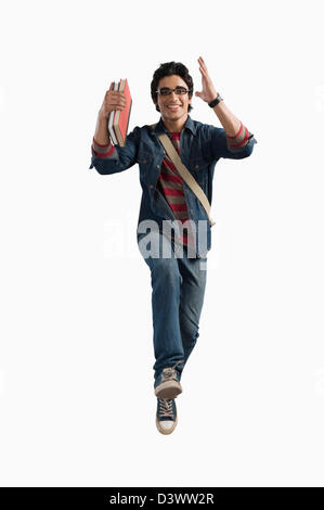 Studentin mit Büchern und Tasche Stockfoto