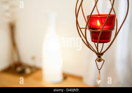 Kerze im roten Glas Stockfoto