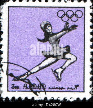 AJMAN - ca. 1972: Eine Briefmarke gedruckt in Ajman zeigt Skater, ca. 1972 Stockfoto