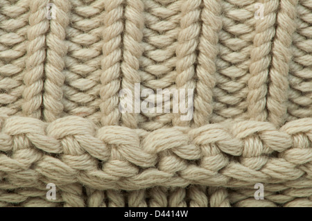 Alten Strickpullover Hintergrund. Beige Farbe. Studio gedreht Stockfoto