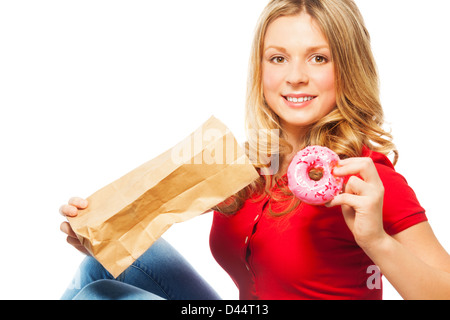 Schöne kaukasischen Teengirl Donut aus Papier eine Mittagspause wieder übernehmen Stockfoto