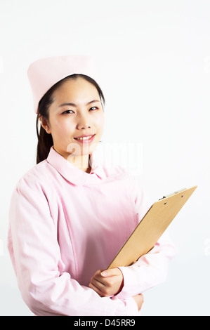 Junge hübsche asiatische Krankenschwester. Stockfoto