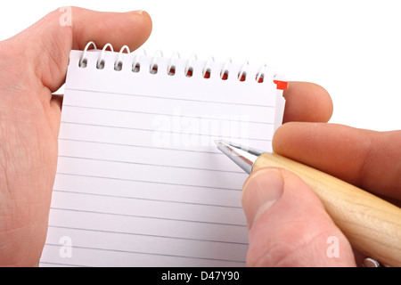 Hände mit Kugelschreiber Notizblock auf isolierten weißen Hintergrund. Stockfoto