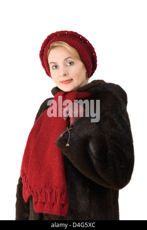 Die schöne Frau in einem Pelzmantel auf dem weißen Hintergrund Stockfoto