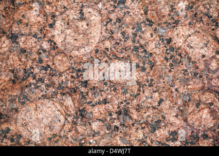 Detailliertes Relief Textur aus rotem Granitstein Stockfoto