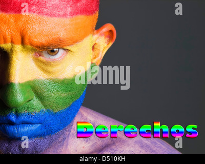 Hombre Con la Bandera Homosexuell Pintada de la Cara y Con Expresion Seria. La Palabra "Derechos" Esta Escrita En un Lado. Stockfoto