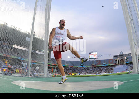 Polnische Diskuswerfer Piotr Malachowski wirft bei den Leichtathletik-Europameisterschaften in Barcelona, Spanien, 1. August 2010. Foto: Rainer Jensen Stockfoto