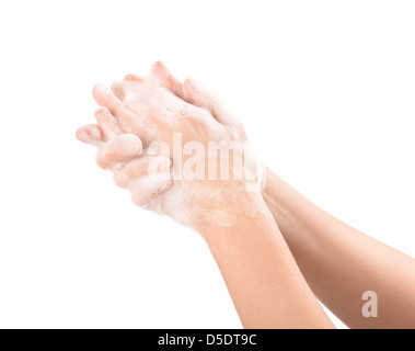 Eine Frau wäscht ihre Hände mit Seife. Isoliert auf weiss. Stockfoto