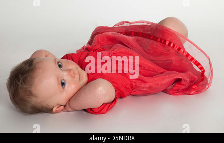 Baby im rosa Kleid Stockfoto