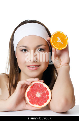 Die schöne Frau mit einer grapefruit Stockfoto