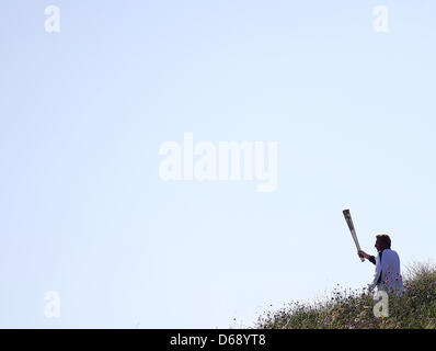 Ehemaliger deutscher Tennisspieler Boris Becker läuft mit der Olympischen Fackel in London, Großbritannien, 24. Juli 2012. Die Olympischen Spiele 2012 in London wird am 27. Juli 2012 beginnen. Foto: Friso Gentsch +++(c) Dpa - Bildfunk +++ Stockfoto