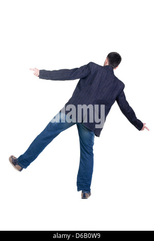 Balancieren jungen Mann in der Jacke. Sicht nach hinten. Isoliert auf weiß. Stockfoto