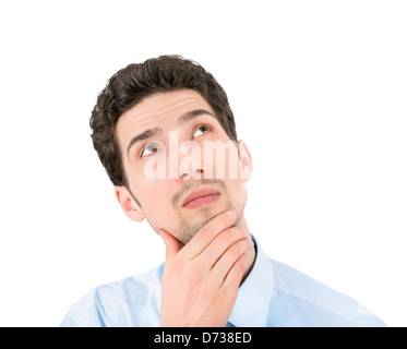 Porträt eines jungen nachdenklich Geschäftsmann Exemplar blickte. Isoliert auf weißem Hintergrund. Stockfoto