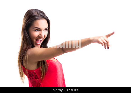 Schöne junge Frau zeigte auf etwas über einen weißen Hintergrund isoliert Stockfoto