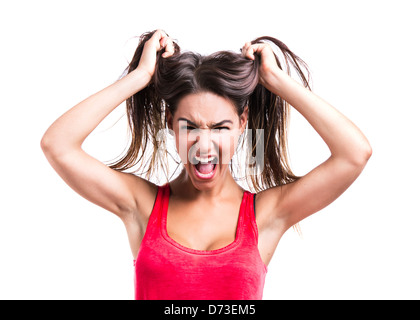 Schöne junge Frau packte ihre eigenen Haare, isoliert auf weißem Hintergrund Stockfoto