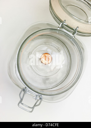 Letzte Penny in einem Glas Stockfoto