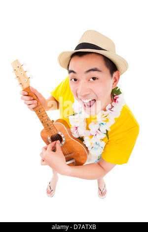 junger Mann spielt Ukulele und Gesang Stockfoto