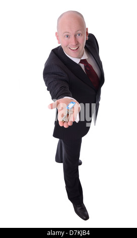 Geschäftsmann hält Schlüssel isoliert auf weißem Hintergrund Stockfoto