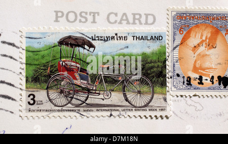 Briefmarken aus Thailand mit Rikscha Stockfoto