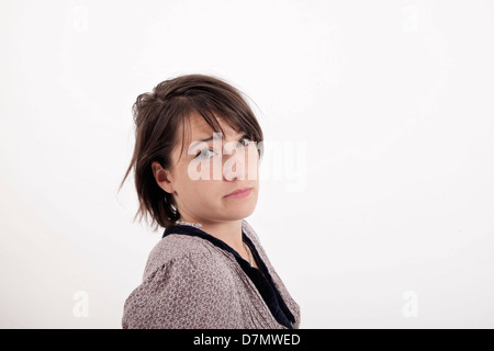 Variation-Ausdruck auf dem Gesicht eine junge Brünette Frau im studio Stockfoto