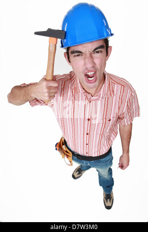 Bauarbeiter mit dem Hammer auf den Kopf Stockfoto