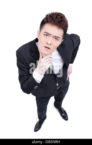 Junger Geschäftsmann mit einem verwirrten Blick Stockfoto