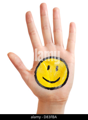 Offener Hand mit einem glücklich lächelnde Smiley-Symbol gemalt isoliert auf weißem Hintergrund Stockfoto