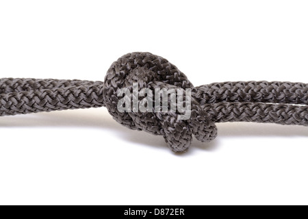 Schwarzen Seil Knoten auf weißem Hintergrund Stockfoto