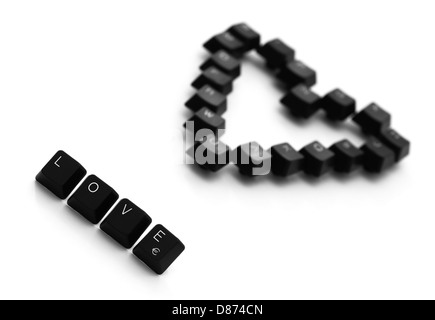 Zeichen der Liebe und Herz gemacht der Tasten der Tastatur auf einem weißen Hintergrund. Stockfoto