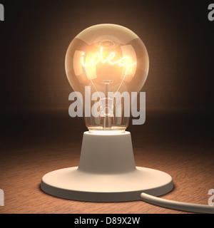 Lampe leuchtet mit der Filament-Form des Wortes Idee. Stockfoto