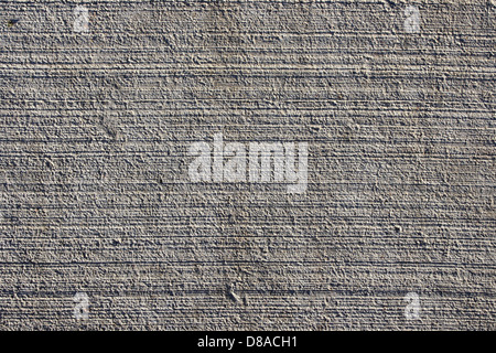 Eine detaillierte Nahaufnahme der Zementstruktur mit seiner rauen und körnigen Oberfläche, die häufig in Bau- und Bauprojekten verwendet wird. Stockfoto