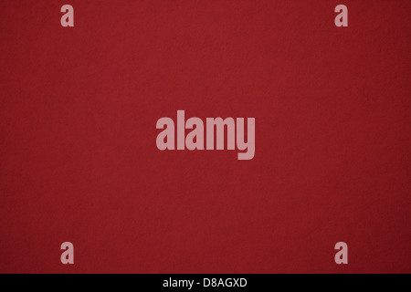 Dieses Nahaufnahme-Bild zeigt die Textur von rotem Papier und seine satte, glatte Oberfläche und leuchtende Farben. Die Details heben die feinen Variationen und Falten des Papiers hervor und eignen sich perfekt für Hintergründe oder künstlerische Zwecke. Stockfoto