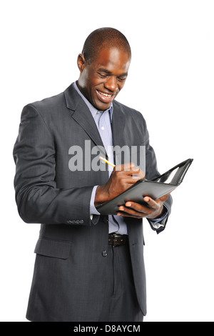 Lächelnde schwarze Jungunternehmer Notizen auf einem weißen Hintergrund isoliert Stockfoto