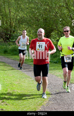 Männer laufen in 2013 Stratford 220 Triathlon Stockfoto