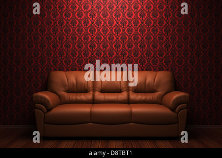 Braune Ledercouch vor roter Wand Stockfoto
