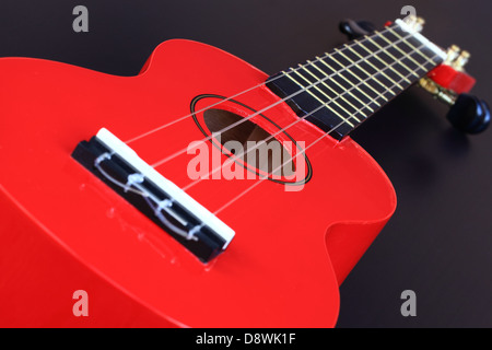 Rote Ukulele Stockfoto