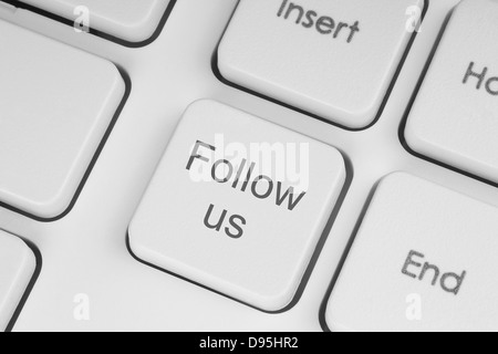 Folgen Sie uns Taste auf der Tastatur Hintergrund Stockfoto