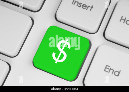 Grüne Taste mit Dollar-Symbol auf der Tastatur Nahaufnahme Stockfoto