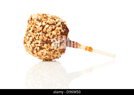 Hausgemachte Taffy Apple mit Erdnüssen gegen einen Hintergrund Stockfoto