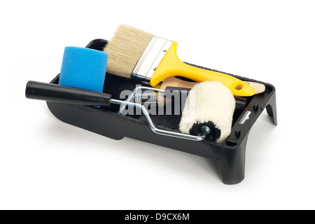 Malen Sie Rollen und Pinsel auf schwarzen Tablett Stockfoto