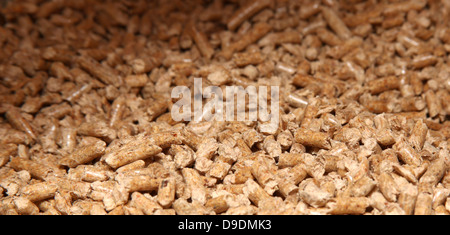 Holz-Pellets bilden ein Hintergrundmuster Stockfoto